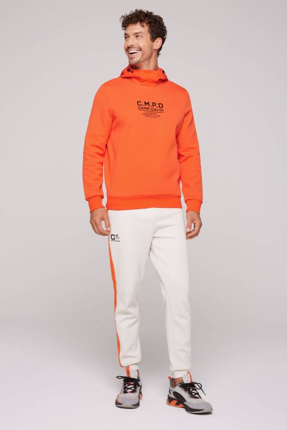 Soccx Hoodie im Materialmix mit Artwork und Rückentasche signal orange Bis zu 50% Rabatt