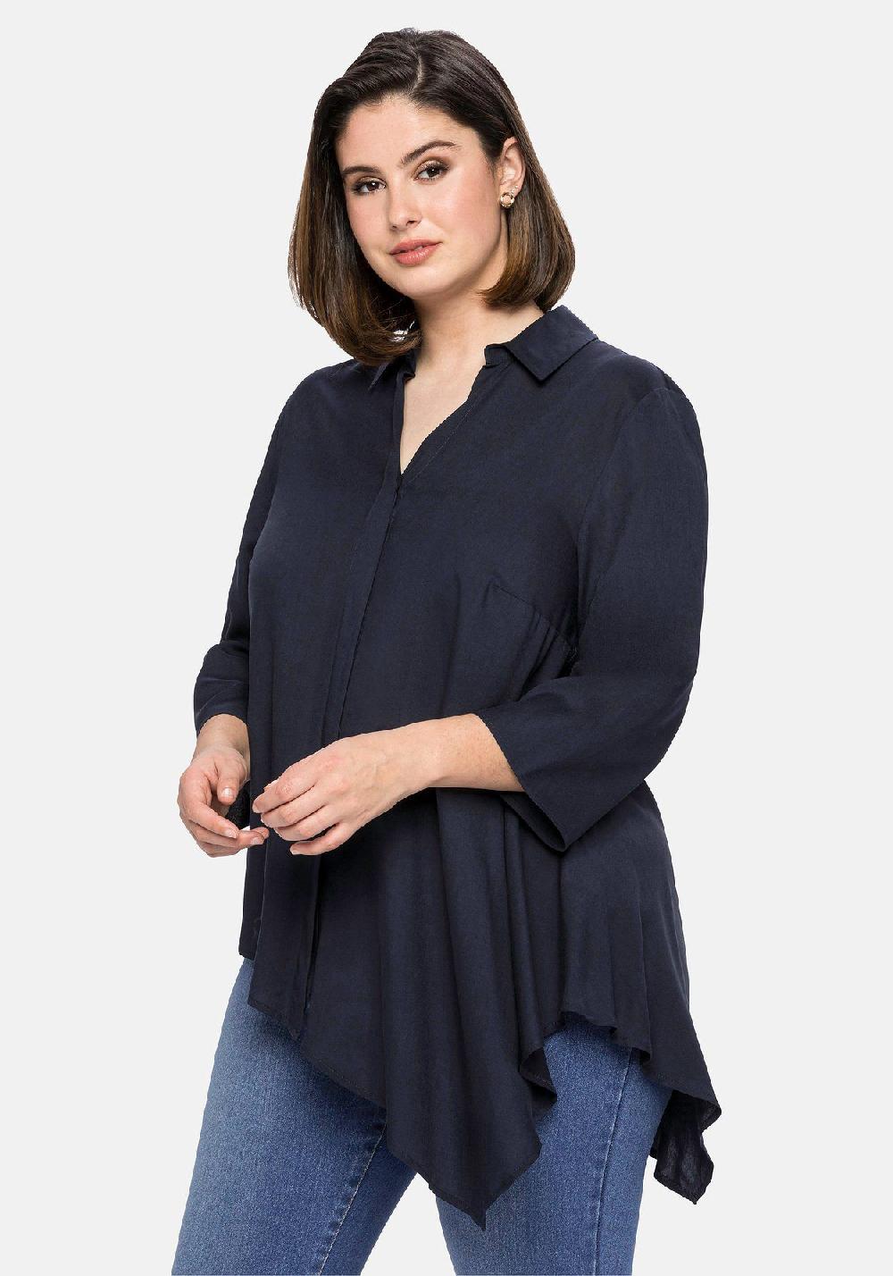 sheego Bluse mit asymmetrischem Saum in Zipfelform 2025